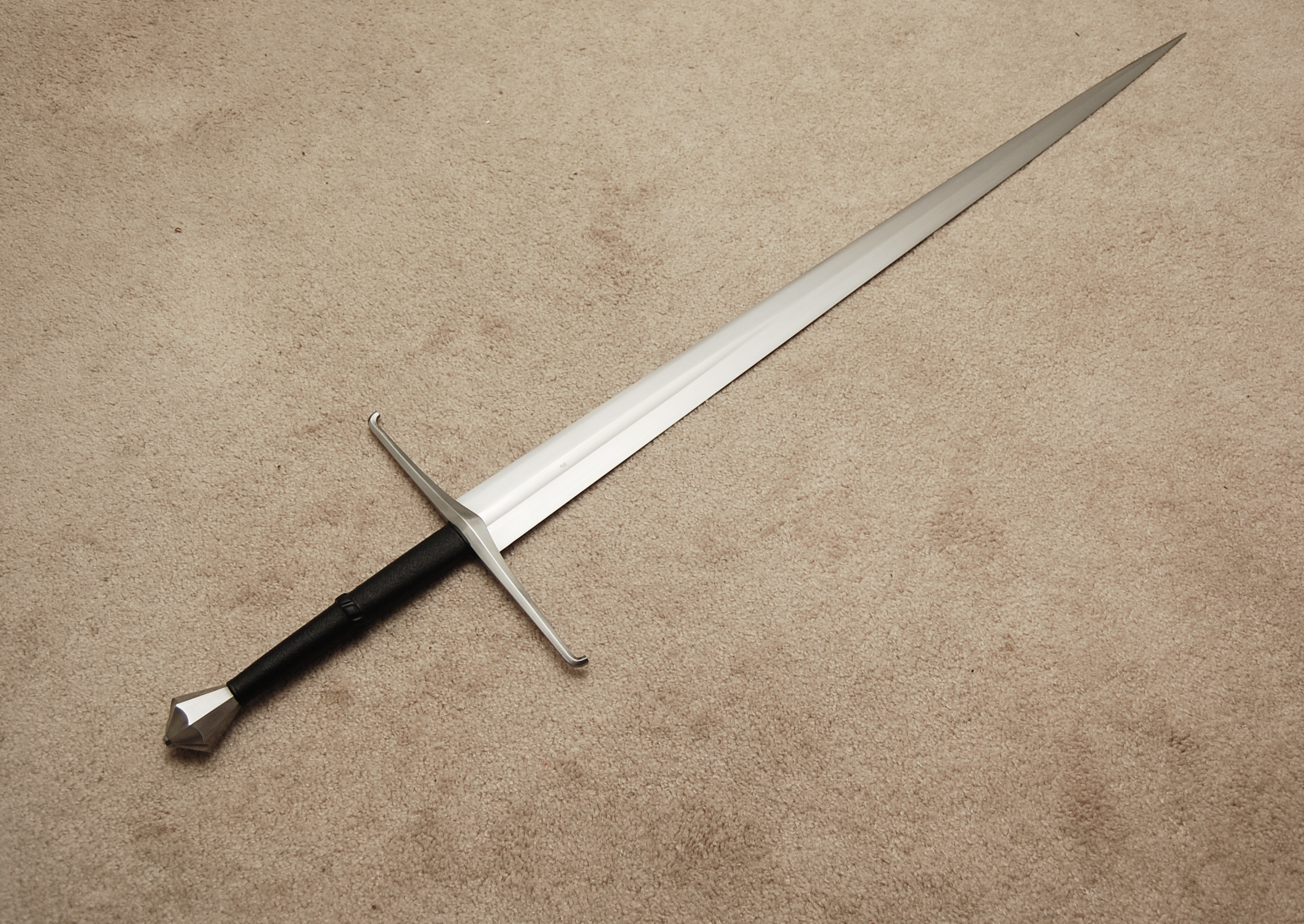 Reproduction of an early 15th century longsword, found in the Museo Civico L. Mazzoli, Brescia, Italy.